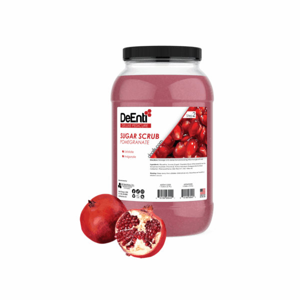 A 1-gallon clear jar of pink DeEnti Pomegranate Sugar Scrub, an exfoliating product for a rejuvenating pedicure, shown with a fresh pomegranate.